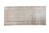 Faded distressed vintage hand-knotted Turkish Oushak rug, light white and pewter tones.
