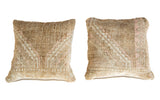 Vintage Turkish Oushak hand knotted rug pillow pair with subtle pink and ivory geometric pattern.
