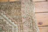 Close-up of vintage Turkish pillow fabric, subtle pink geometric tone-on-tone knotting.