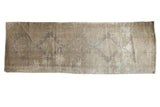 Distressed Turkish Oushak runner featuring faded medallions in soft ivory, beige, and bronze.