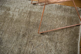 Muted ivory and beige distressed texture of the vintage Oushak runner.