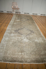 Textured distressed vintage Oushak runner with soft ivory, beige, and coffee bronze hues.