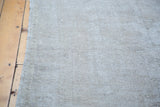 Textured, distressed Oushak rug pile with embossed character and recessed wool.