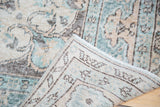 Hand-knotted foundation and Lehla Abassi border detail of a distressed Oushak rug.