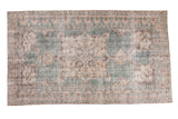Designer distressed Oushak rug with faded teal field, apricot quatrefoil medallion, and prawn border.