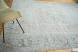 Distressed Oushak carpet corner, blush field, silvery grey border, geometric and scrolling motifs.
