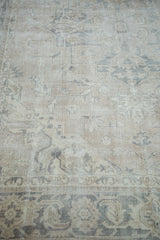 Distressed texture and muted grey with blanched ivory tones on a Turkish Oushak rug.