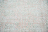 Distressed pile, hand-knotted Oushak with sun-faded rose blush, mint celadon palmettes.