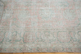 Distressed Oushak carpet detail, with delicate rose blush palmettes and mint celadon tones.