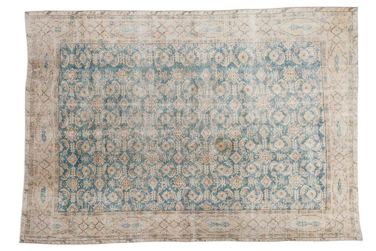 Distressed vintage Turkish Oushak rug, teal blue allover pattern, faded beige border.
