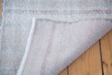 Hand-knotted foundation and worn fringe on a distressed vintage Oushak runner.