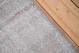 Distressed hand-knotted Oushak runner with muted beige, brown stripes, woven edge.