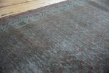 Distressed texture with subtle overdyed tones on the vintage Persian Serbend runner.