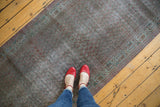 Distressed vintage Sparta runner, subtle overdyed colors, geometric border, feet.