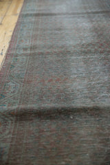 Angled detail of the vintage overdyed Sparta runner's distressed pile with muted teal and rust tones.