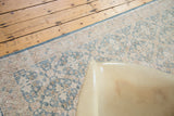 Textured sun-faded green and beige lattice pattern on a distressed Sivas runner.