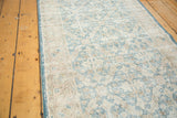 Distressed vintage Sivas runner with faded light blue and beige lattice texture.