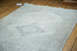 Distressed Turkish Sparta runner detail: blanched ivory, beige, and faded charcoal medallion pattern.