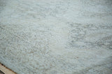 Blanched ivory and beige distressed texture with faint medallion patterns on a Sparta runner.