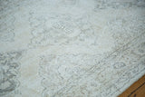 Distressed pile texture with blanched ivory, beige, and faded charcoal pattern.