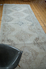 Distressed vintage Turkish Sparta runner, muted ivory, beige, coffee bronze tones and softened medallions.