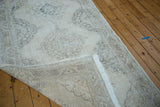 Distressed Sparta runner, soft ivory and beige, showing hand-knotted foundation and fringe.