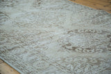 Distressed Rococo design on a Sparta runner in soft ivory and coffee bronze tones.