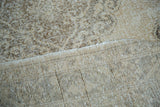Distressed pile texture in soft ivory and beige tones with tight hand-knotted backing.