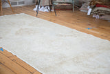 Soft ivory and beige tones on this distressed Sparta runner with faded medallions.