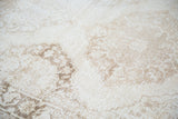 Distressed vintage Turkish Sparta runner showing faded lattice patterns in soft ivory and beige.
