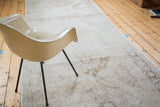 Visible distressed texture and faded lattice medallions on an ivory and beige Sparta runner.
