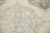 Distressed hand-knotted Turkish Sparta runner with ivory, beige, and pewter medallion detail.