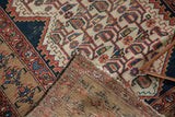 Distressed geometric patterns on hand-knotted pile and durable woven foundation of a vintage Malayer runner.