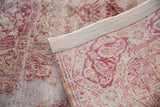 Hand-knotted back and reinforced twill edge of a distressed Sivas rug.
