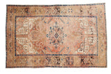 Vintage Kars Heriz carpet, dusty blush medallion, indigo borders, scrolling floral vines, 6'4