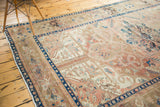 Deep indigo blue border and dusty blush field with Heriz design on vintage Kars rug.