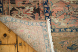 Fringe and hand-knotted reverse of a vintage Kars carpet with dusty blush and indigo tones.