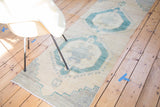 Vintage Oushak runner with mallard green octagonal medallion, pearl design, and end fringe.