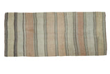Vintage Persian Kilim runner with vertical beige, light gold, and grey geometric stripes.