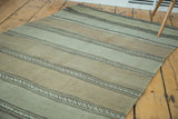 Vintage Kilim runner, close-up of geometric serpent pattern within light gold and beige stripes.