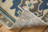Vintage Turkish Oushak rug corner, showing hand-knotted foundation and geometric pattern.