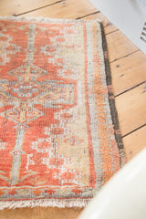 Close-up of hand knotted Oushak rug pile, cherry red field, rectilinear and curvilinear pattern, silver border.