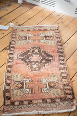 Vintage Oushak rug, dark stepped medallion, ivory florals, cinnabar red field, tree motifs.