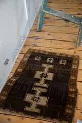 Deep chocolate field with geometric double-crossed medallion and bronze star border.