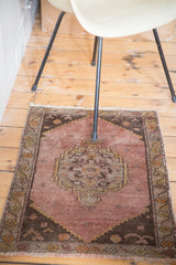 Distressed Turkish Oushak rug with unique mauve field and silver charcoal medallion.
