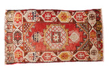 Vintage Oushak rug mat, cherry red field with octagonal star medallion, geometric border.