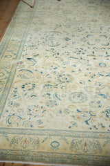 Distressed Sivas carpet detail with faded saffron field, floral patterns, celadon border.