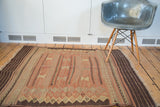 Hand woven Turkish Jijim flatweave featuring faded cranberry, charcoal, and beige diamond panels.