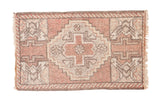 Blush Oushak rug mat with grey stepped diamond, germinating tree motifs, barber pole border.