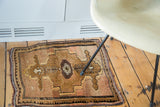 Diminutive reciprocating borders and bronze coffee abrash on a vintage Oushak rug.
